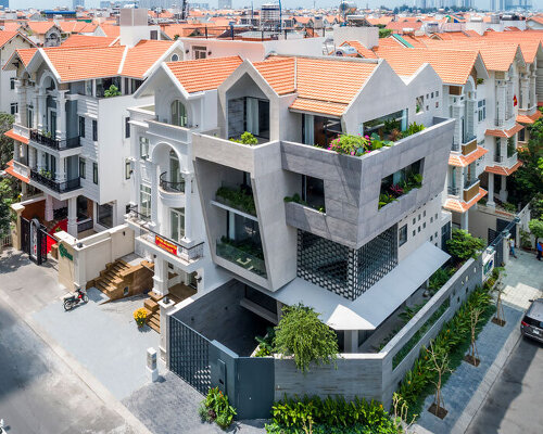 23o5studio interrupts a suburban block in vietnam with sloping concrete J14 house