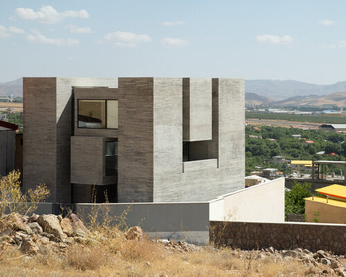 iranian studio MAAN sculpts its monolithic 'ayenevarzan house' of solids and voids