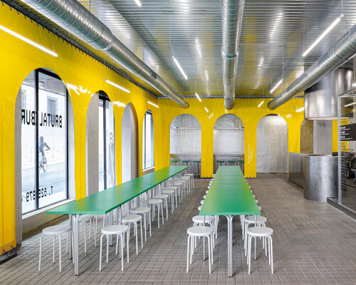 yellow plastic arcades dress 'brutal burrito' fast food restaurant in madrid