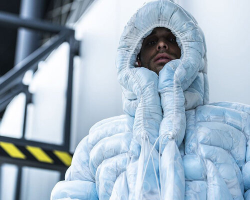 coat-19 is an icy blue puffer jacket stuffed with used facemasks