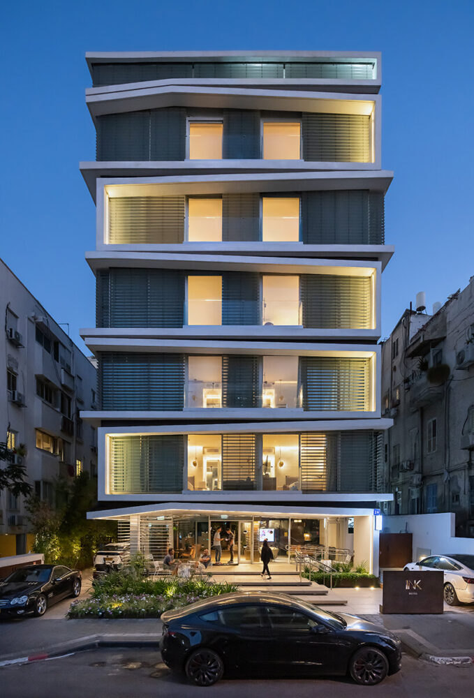 ink hotel emerges as a pile of stacked books in the heart of tel aviv ...