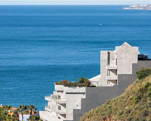 materiality and topography converse within apartment complex renovation in malaga, spain