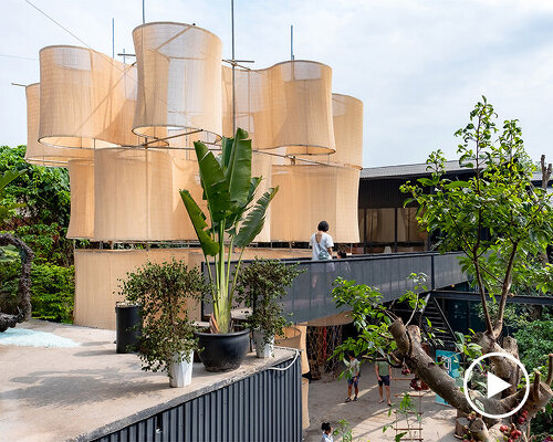 sculptural pavilion revives old factory area in vietnam, inviting visitors to wander and explore