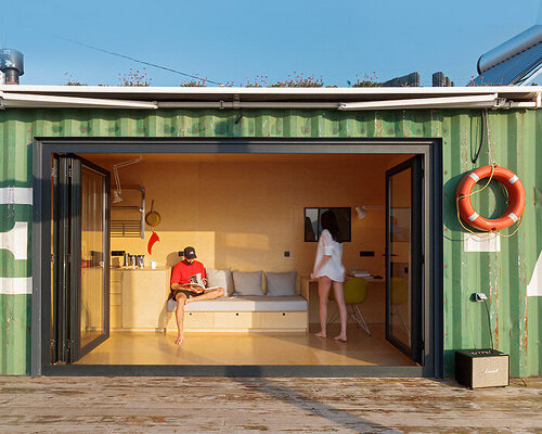 steel shipping container is transformed into relaxing getaway by the tbilisi sea, in georgia