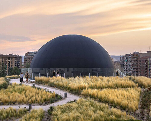 SpY reflects on the symbolism of the oculus with huge black sphere installation in madrid