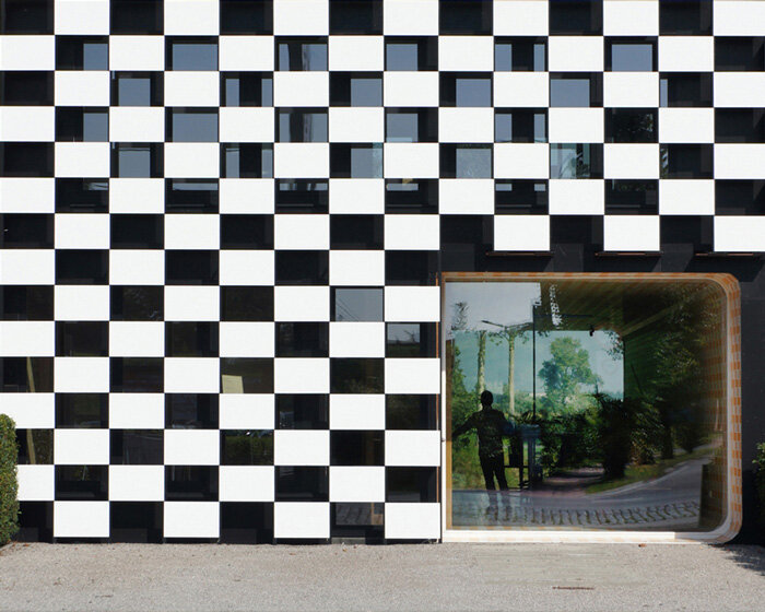 checkered office building in belgium is designed to 'stand out from the crowd'