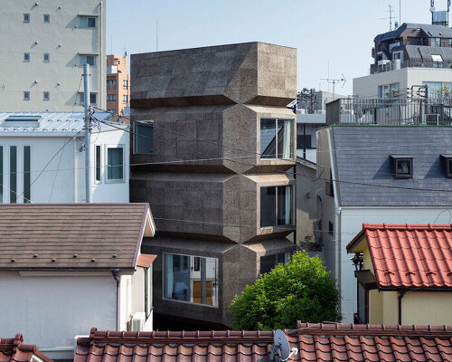 takaaki fuji + yuko fuji builds its 'bay window tower house' with folding cork facade