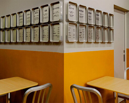 bright yellow tones clad renovated fried food shop in the suburbs of tokyo