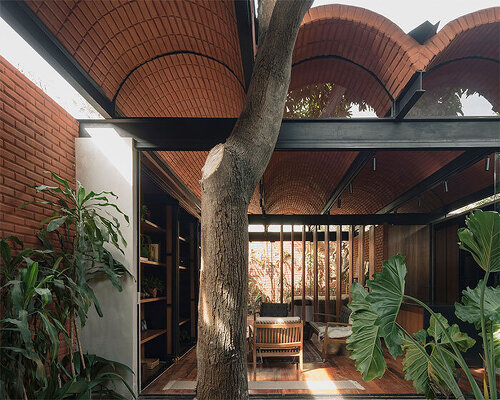 compressed earth blocks and a vaulted roof complete this intermediate house in paraguay