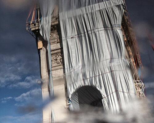 concealment through reflection: 'the arc de triomphe, wrapped' at another glimpse