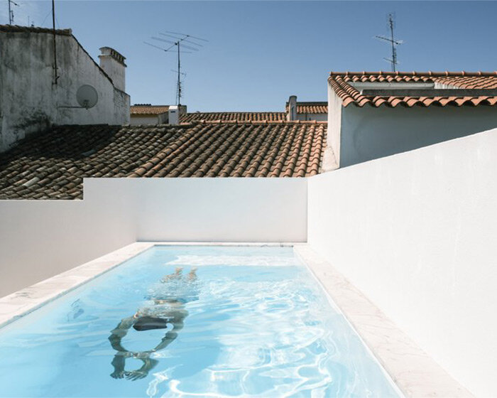 sunny patio with pool becomes the protagonist of 19th-century house renovation in portugal