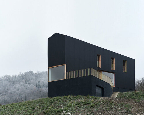 black corrugated metal clads récita architecture's slender house in rural france