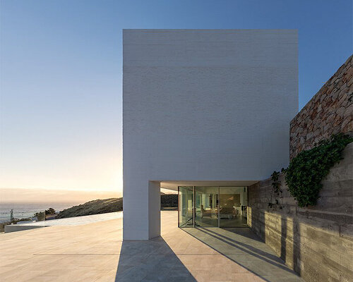 robust concrete pillars support minimalist 'jacaranda house' by JFGS architects in spain