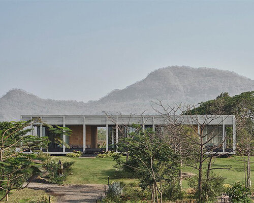 this concrete farmhouse emerges as a gateway cabin in karjat, india