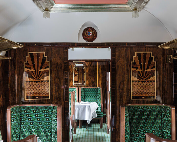 wes anderson revives 1950s train carriage inviting visitors into whimsical film sets