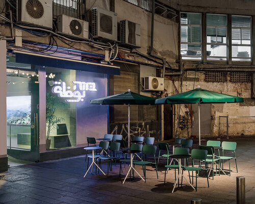 teal green tiles and neon signage characterize 'buza' gelato shop in tel aviv