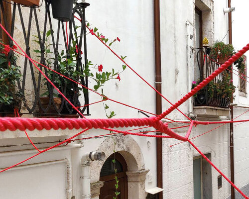 gabriele mundula highlights the depopulation of rural italy with an installation of red ropes