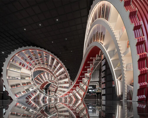 huge spiral staircase serving as a bookshelf takes over x+living's store in china