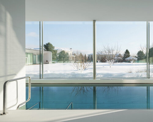 interior swimming pool by blockstudio emerges as a geometric addition to residence in russia