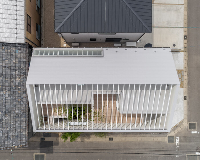 keitaro muto architects completes japanese house with partially-exposed roof