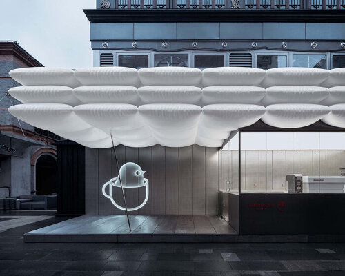 F.O.G. architecture's birdie cup coffee is nested beneath a roof of floating white puffs