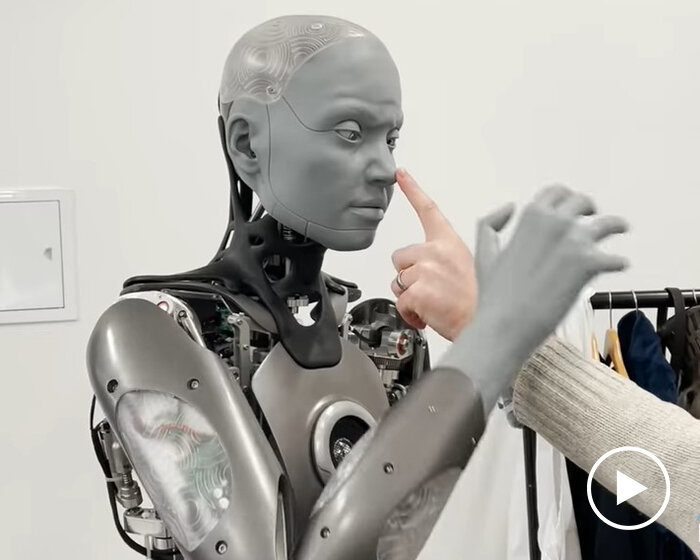 the humanoid robot 'ameca' reacts to a nose poke like a real person