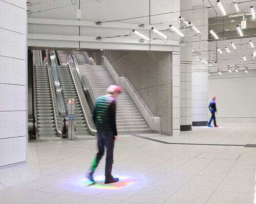 ingo maurer installs RGB spotlights in tram stations to colorize passengers' shadows