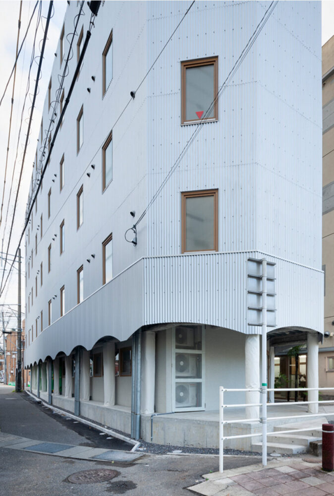 the kotobuki hotel revealed as a striking, architectural collage in japan