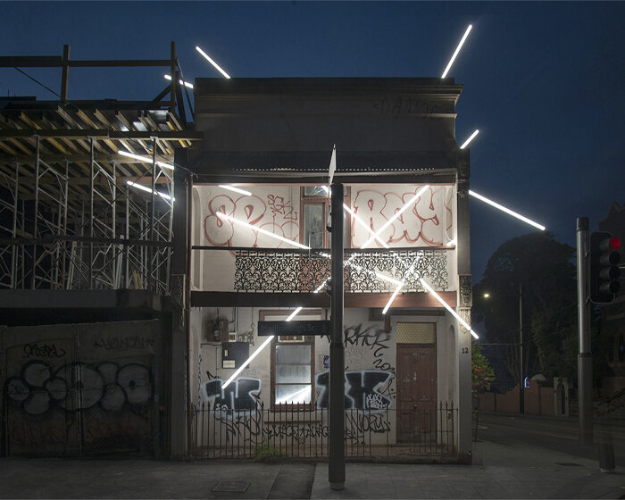 beams of light pierce through this 19th-century derelict building in sydney, australia