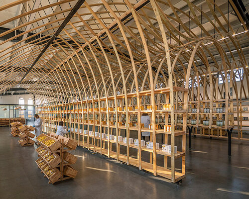 LUO studio bends wooden panels into spellbinding exhibition display