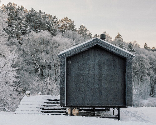 BIO architects' prefab ready-to-inhabit cabin nestles peacefully on river bank in russia