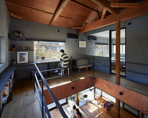 a double height void cuts through this house in japan