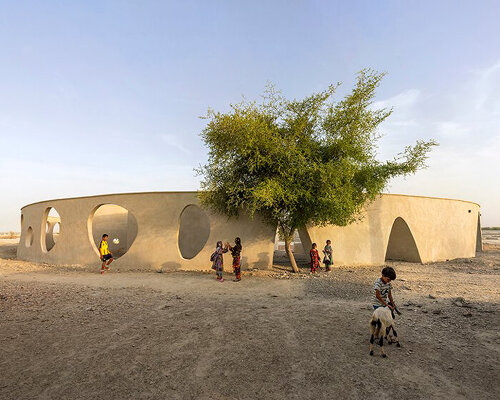 daaz office wraps a 'playful shell' around this circular school in rural iran