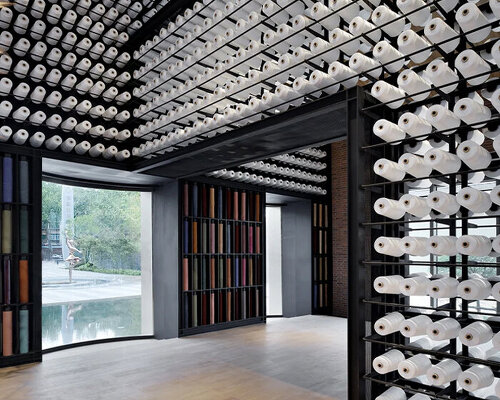 renovated cotton factory in china features nearly 5,000 spindles to honor its history