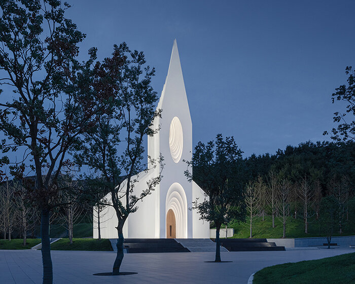 RSAA encloses chamber church with illuminated layered silhouettes in china