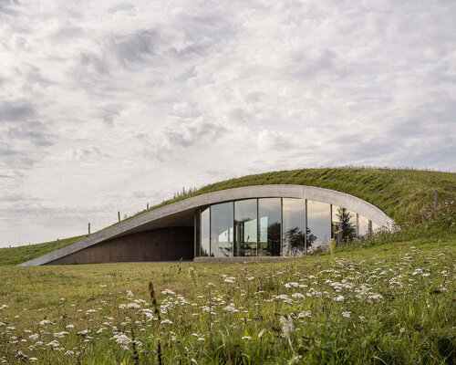 CEBRA embeds its skamlingsbanken center into denmark's rolling, hilly meadows