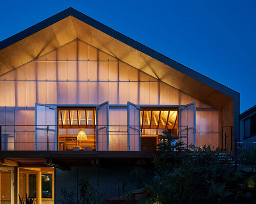 this wooden dwelling in japan filters light through its translucent façade