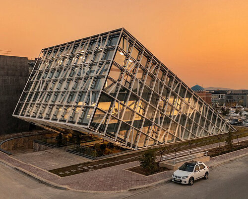 this new office and incubator building in tehran rises dramatically from the ground