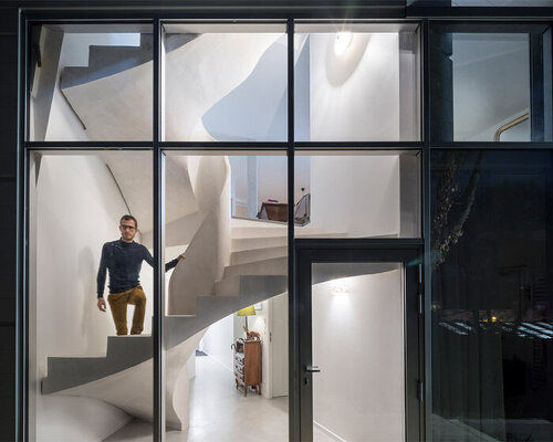 avignon architecte builds 'twist' house with sculptural ribbon staircase in nantes, france