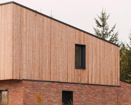 warm-toned wood and brick façades complete family home in poland by studio GAB