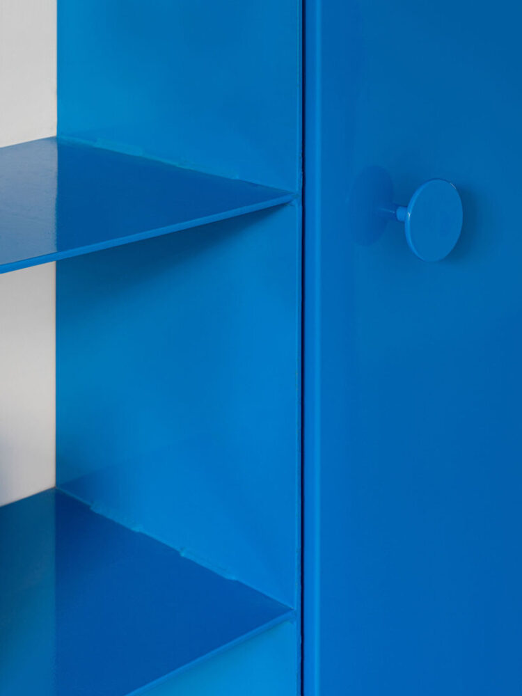 floating blue bookshelf centers BURR’s conversion project in madrid