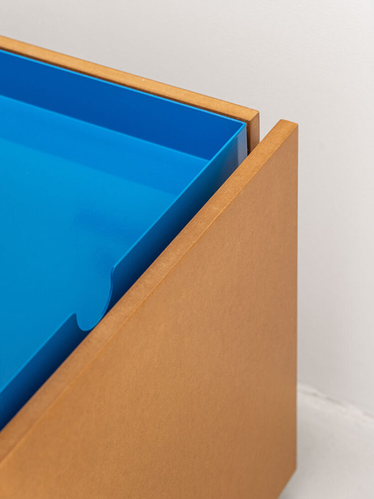 floating blue bookshelf centers BURR’s conversion project in madrid