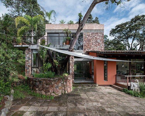 luis carbonell builds mexican getaway complex out of existing stone house
