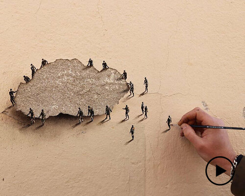 tiny figures by urban artist pejac emerge from the cracks of peeling wall in madrid