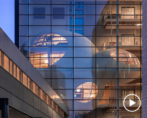 floating pebbles within children's hospital in nijmegen offer a warm domestic atmosphere