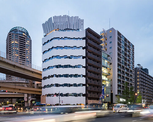 kengo kuma wraps corner building in tokyo with vertical concrete panels