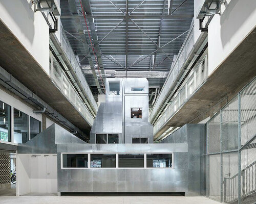 metal engines become the protagonist of industrial hall renovation in france