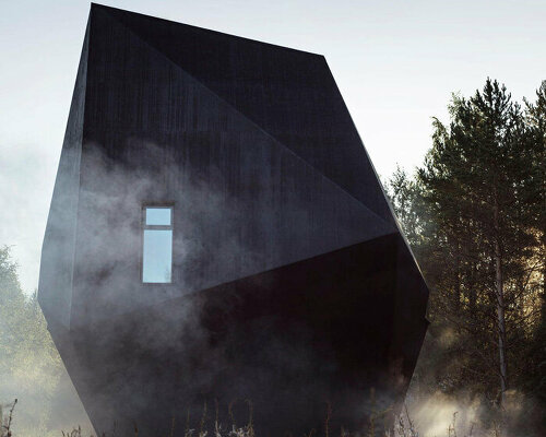 ateljé sotamaa's 'meteorite' residence emerges as a mystical dark object in finland