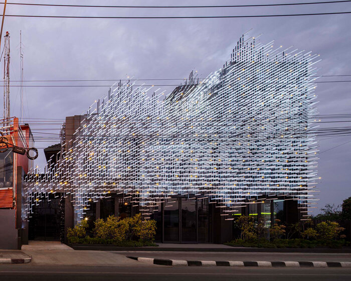 layered aluminum strips evoke dandelion seeds for this museum façade in bangkok