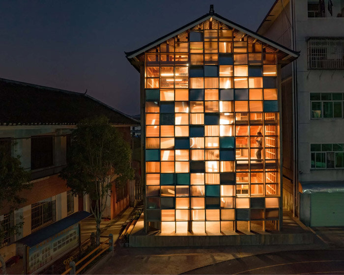 the 'pingtan book house' is a matrix of bookshelves behind a luminous gridded facade